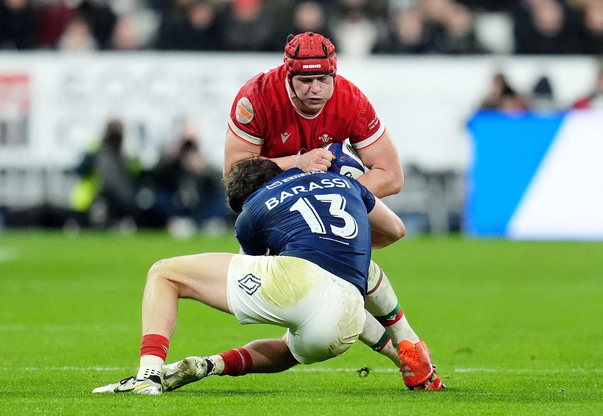 Wales&#8217; James Botham (top) is tackled by France&#8217;s Pierre-Louis Barassi. Pic: Alamy
