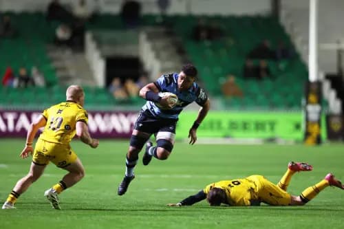 Taulupe Faletau of Cardiff Rugby evades a tackle from Rhodri Williams of the Dragons. Pic: Alamy.